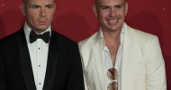 American rapper Pitbull meets his Madame Tussauds Orlando wax figure for the first time!